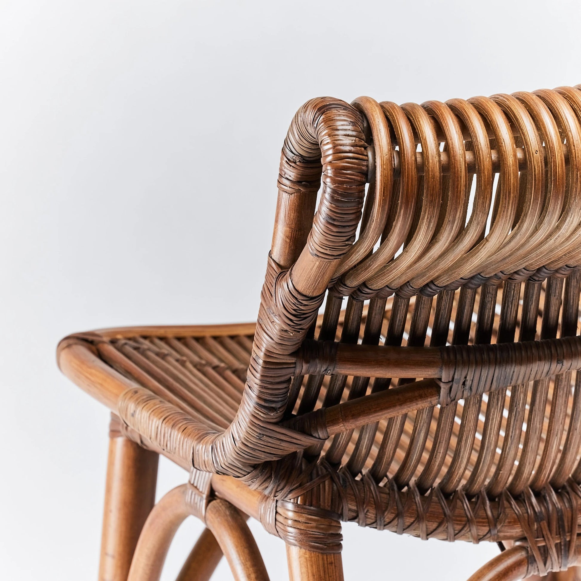 Naples Counter Stool by Interlude Home in warm taupe. Made from rattan in a cottage & farmhouse style.