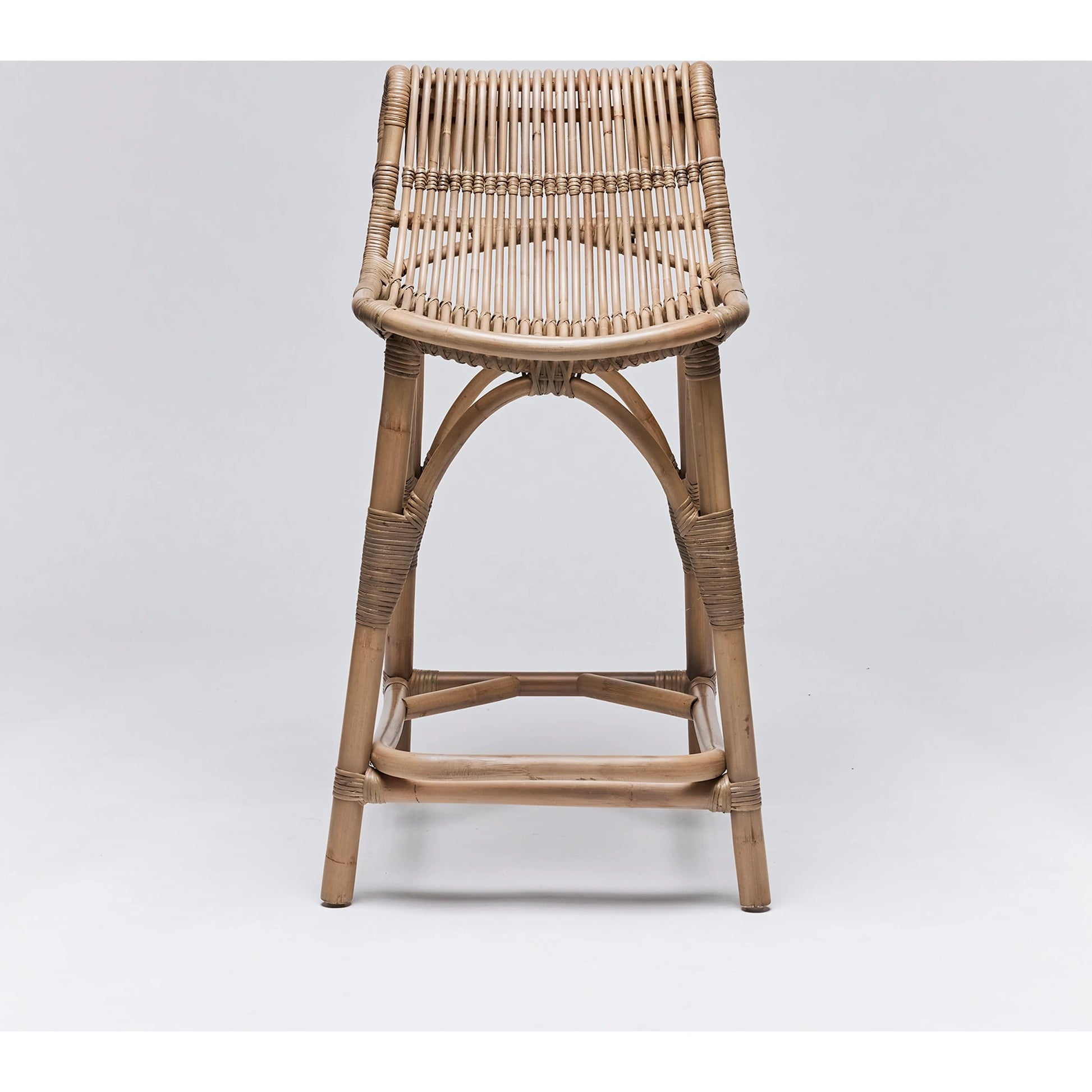 Naples Counter Stool by Interlude Home in warm taupe. Made from rattan in a cottage & farmhouse style.