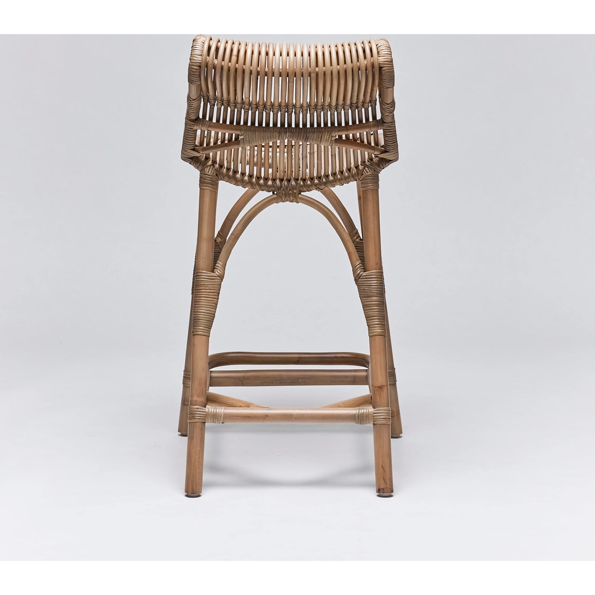Naples Counter Stool by Interlude Home in warm taupe. Made from rattan in a cottage & farmhouse style.