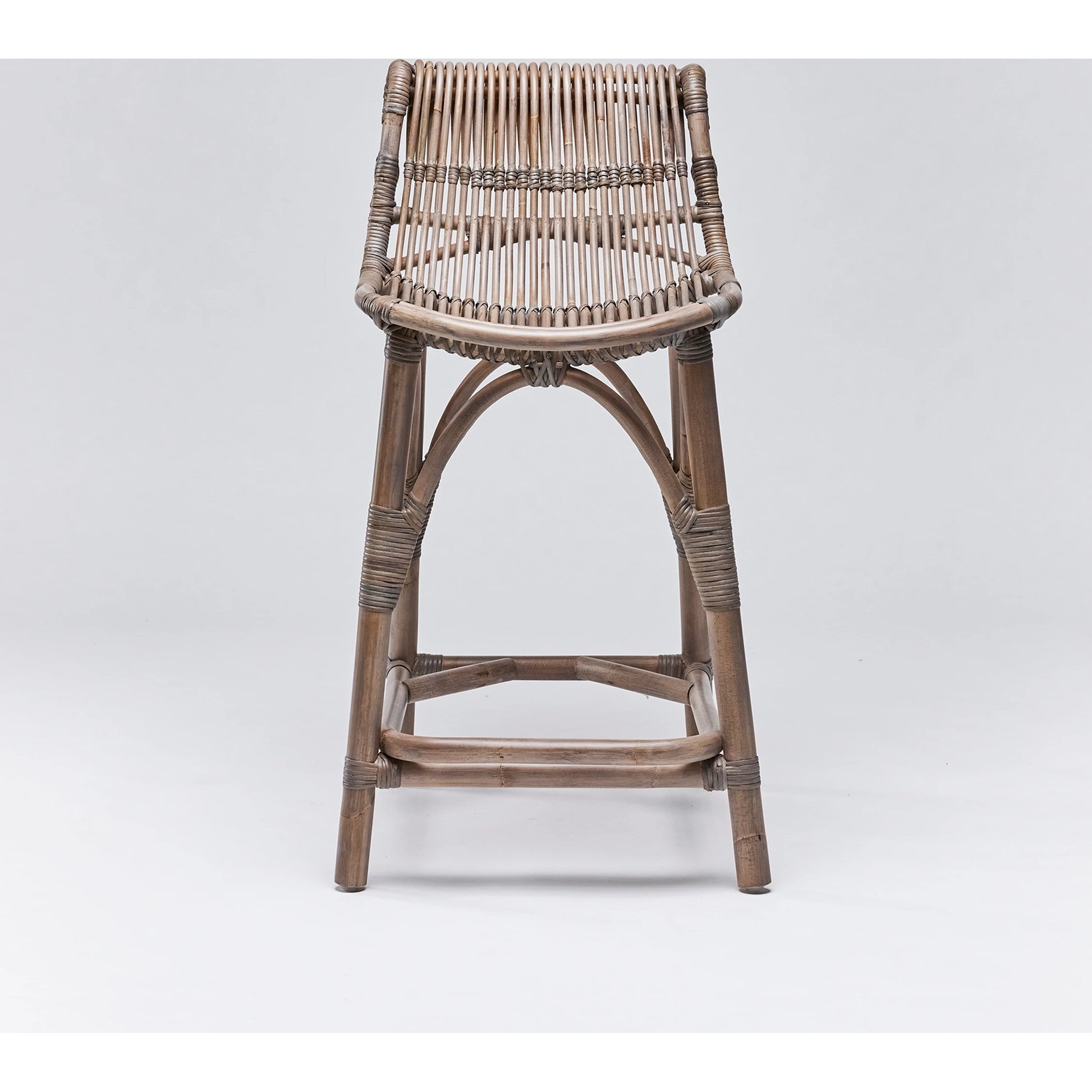 Naples Counter Stool by Interlude Home in warm taupe. Made from rattan in a cottage & farmhouse style.