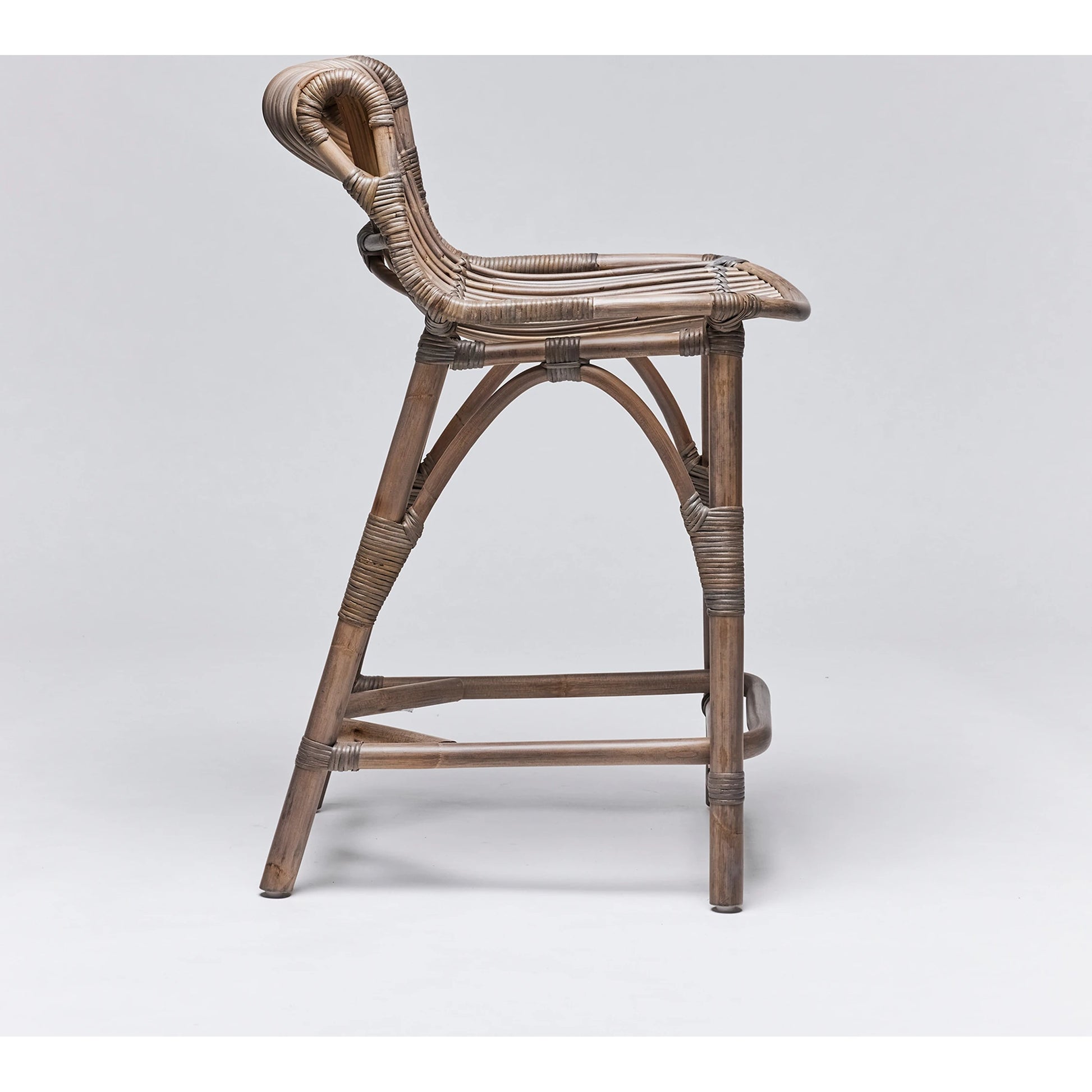 Naples Counter Stool by Interlude Home in warm taupe. Made from rattan in a cottage & farmhouse style.