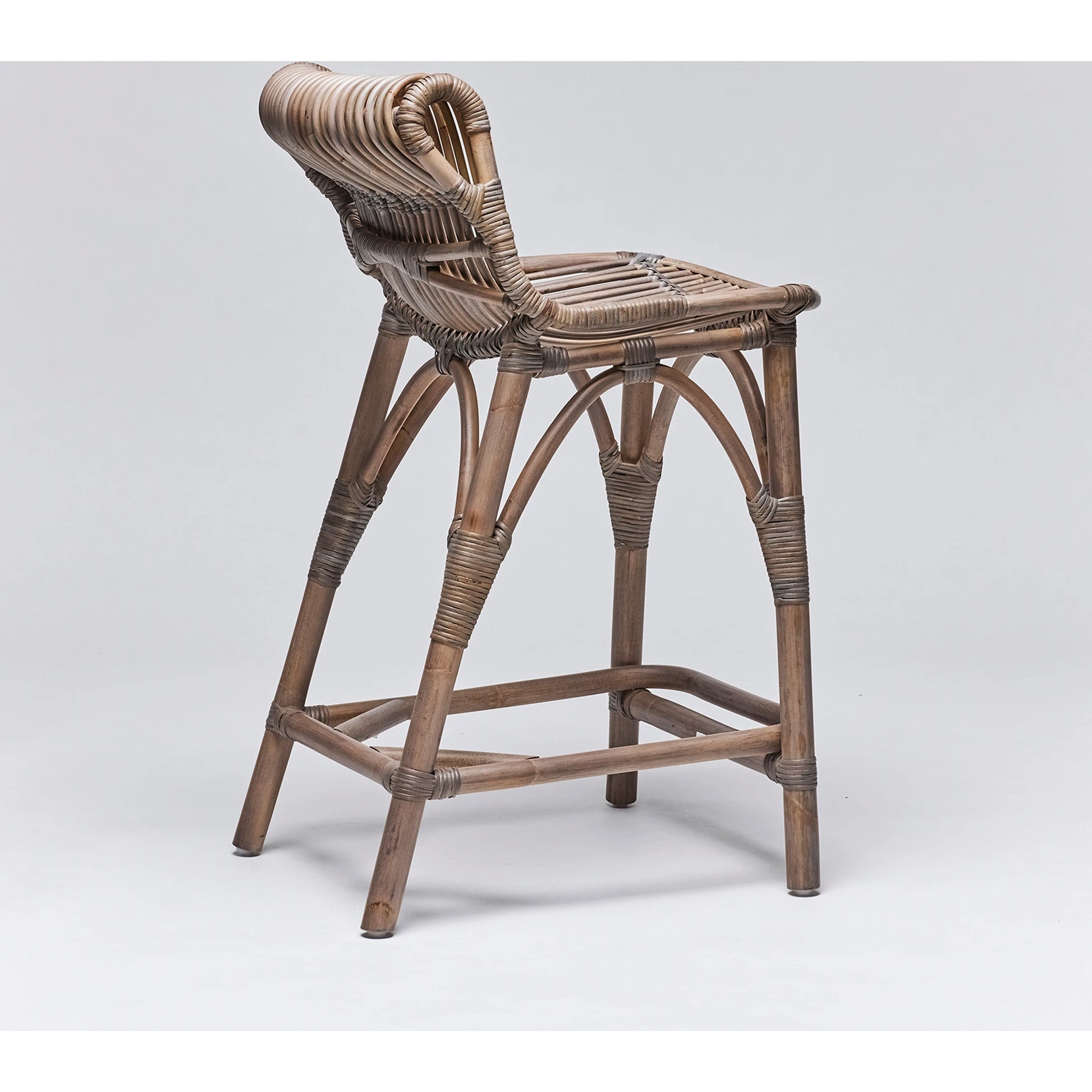 Naples Counter Stool by Interlude Home in warm taupe. Made from rattan in a cottage & farmhouse style.