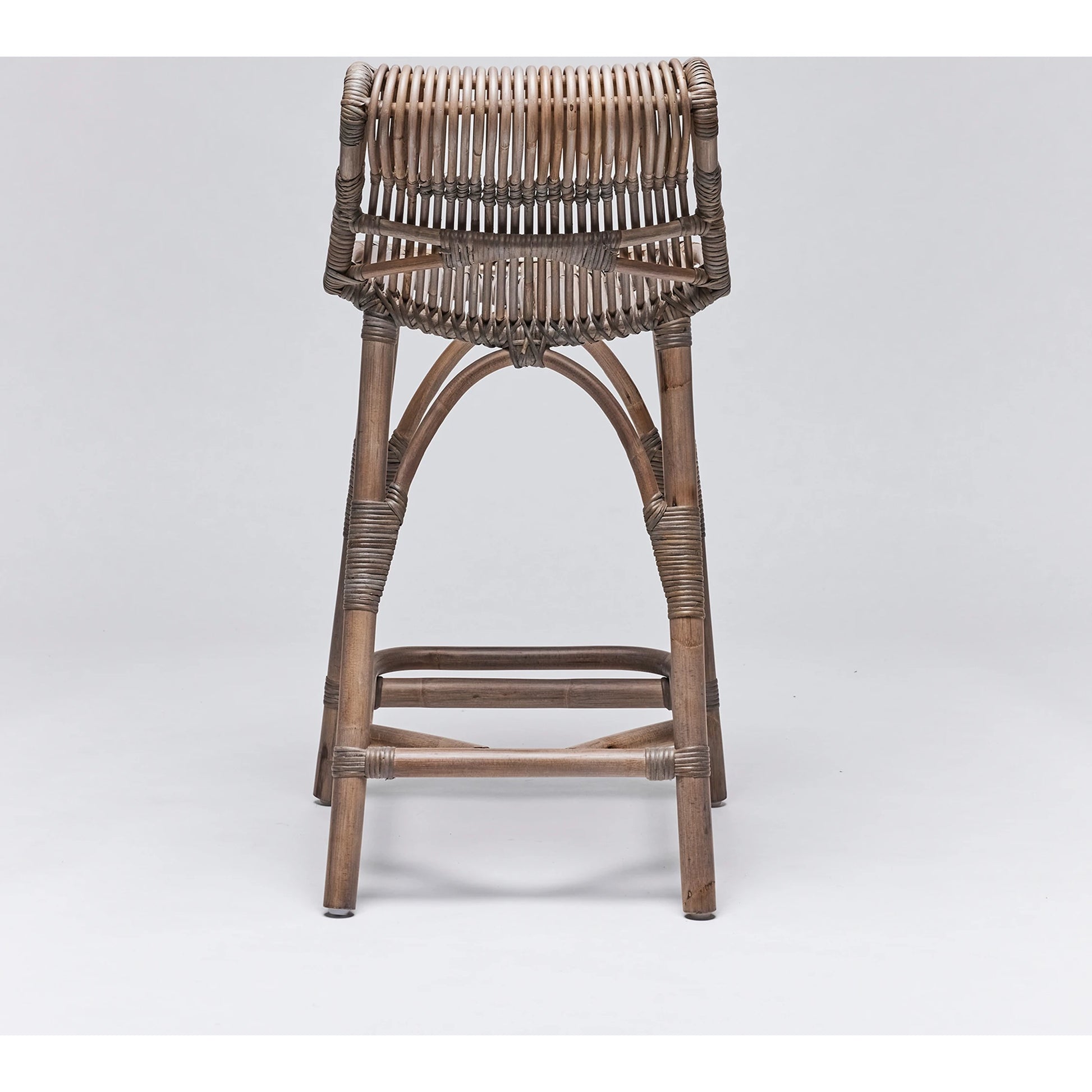 Naples Counter Stool by Interlude Home in warm taupe. Made from rattan in a cottage & farmhouse style.
