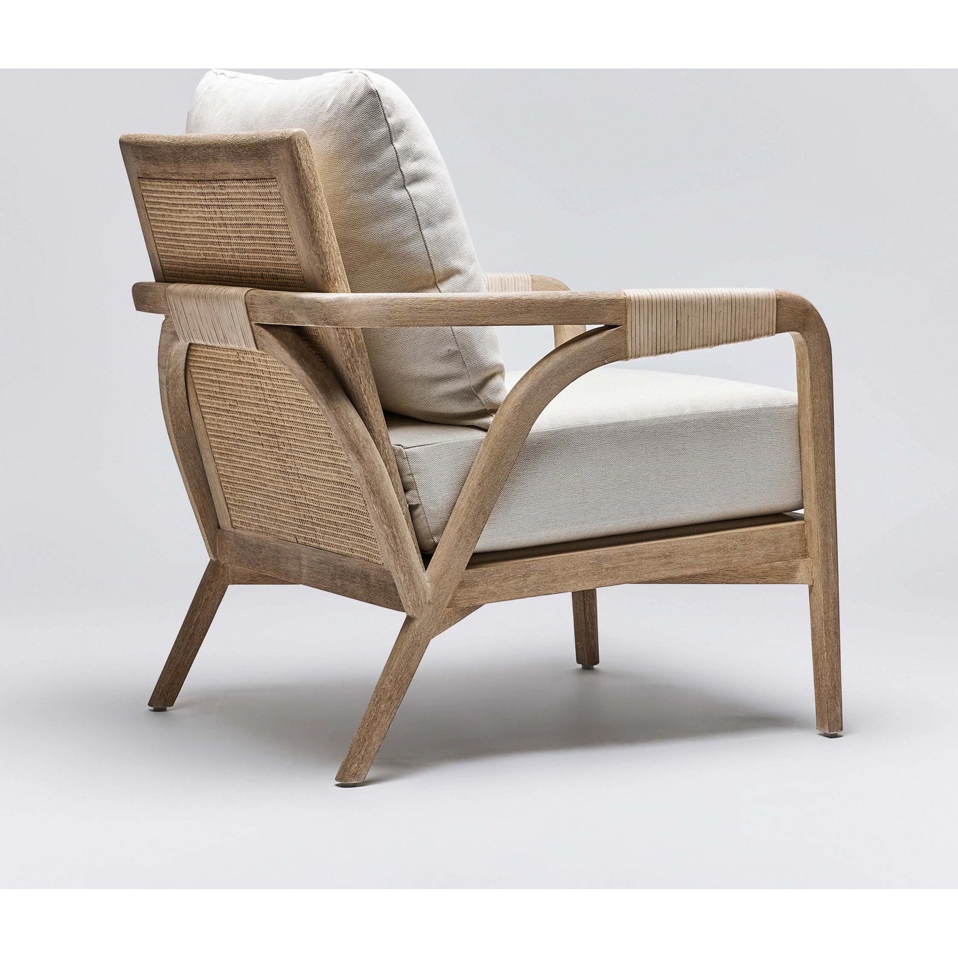 Delray Lounge Chair by Interlude Home. Made from mahogany, rattan, leather, flax weave in a modern style.