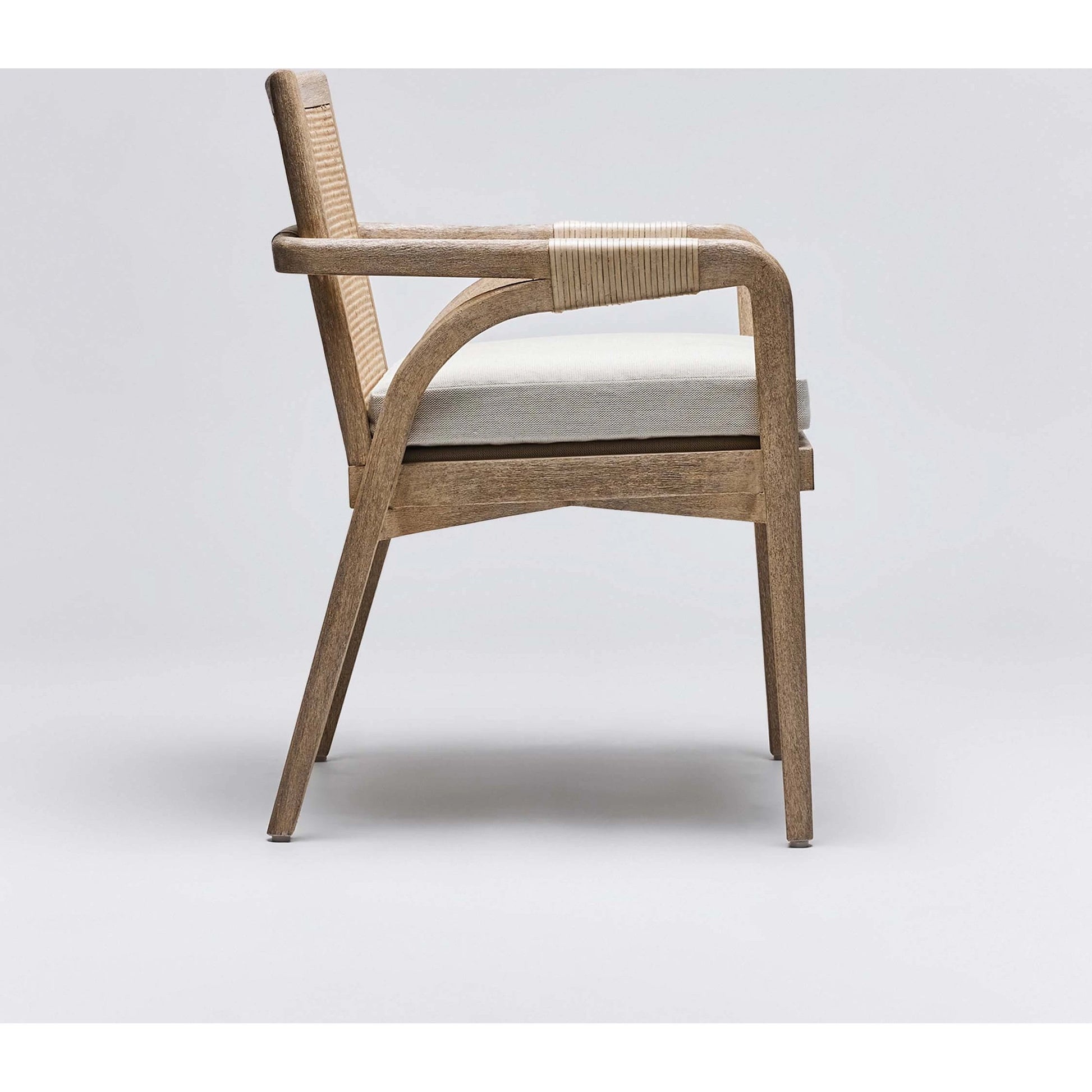 Delray Arm Chair by Interlude Home. Made from mahogany, rattan, leather, flax weave in a cottage & farmhouse style.