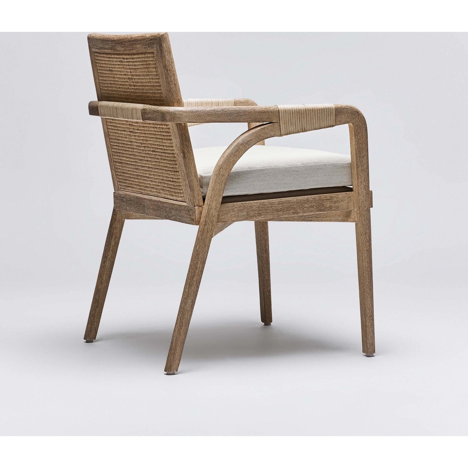 Delray Arm Chair by Interlude Home. Made from mahogany, rattan, leather, flax weave in a cottage & farmhouse style.