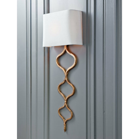 Sinuous Sconce by Regina Andrew in gold and gold leaf. Made from steel in a transitional style.