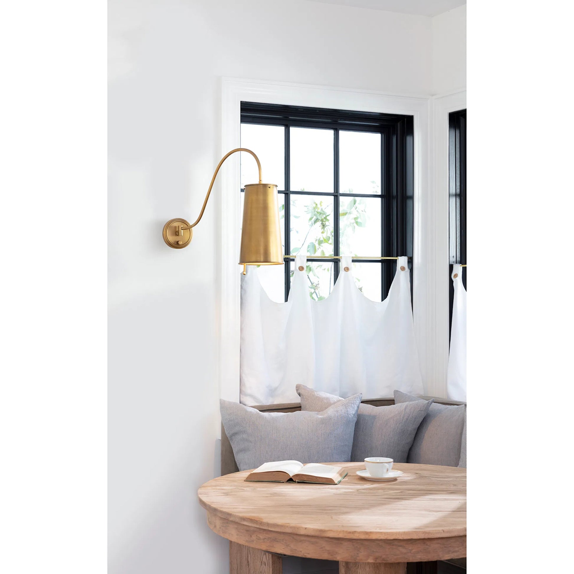 Hattie Sconce by Regina Andrew in brass and natural brass. Made from steel in a modern style.