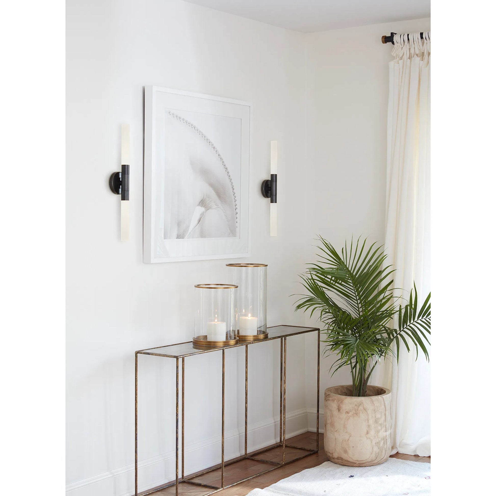 Wick Hilo Sconce by Regina Andrew. Made from steel in a modern style.