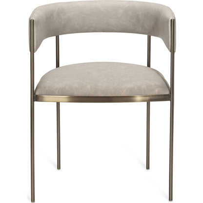 Ryland Dining Chair by Interlude Home in distressed charcoal, antique bronze. Made from faux leather, metal in a modern style.