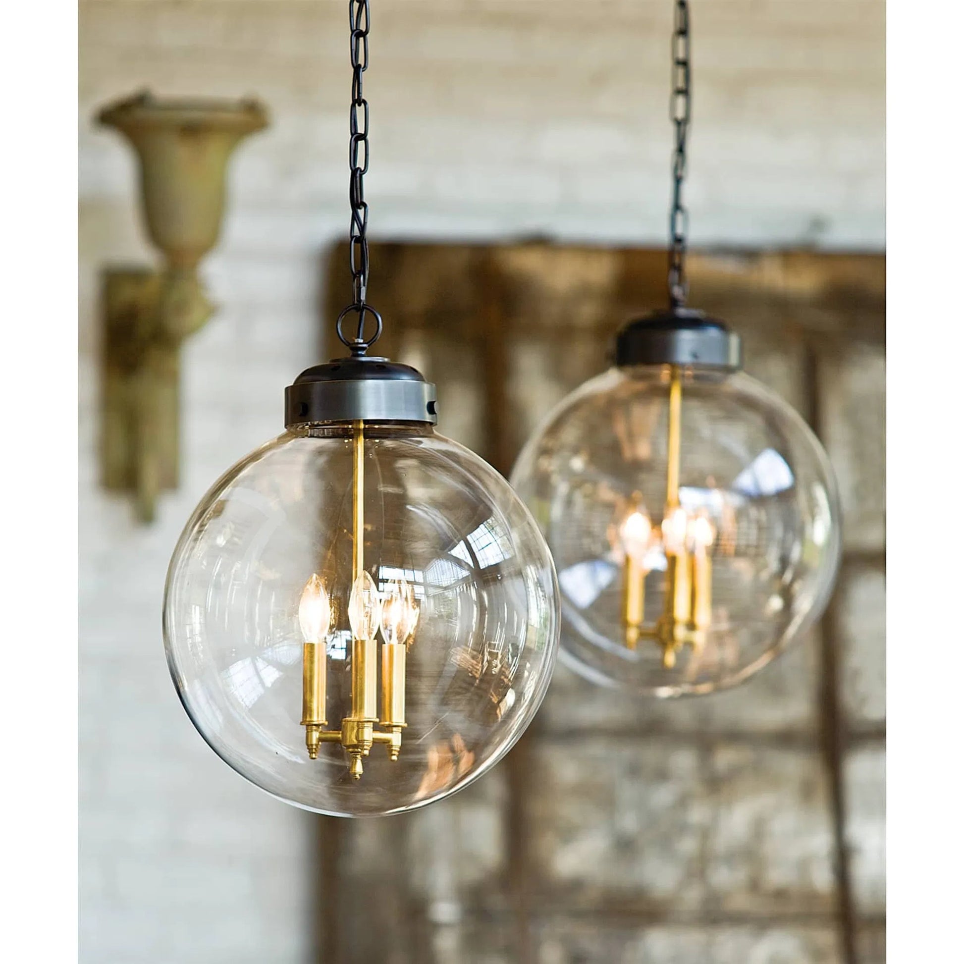 Globe Pendant in Natural Brass by Regina Andrew in brass and natural brass. Made from cast zinc in a traditional style.