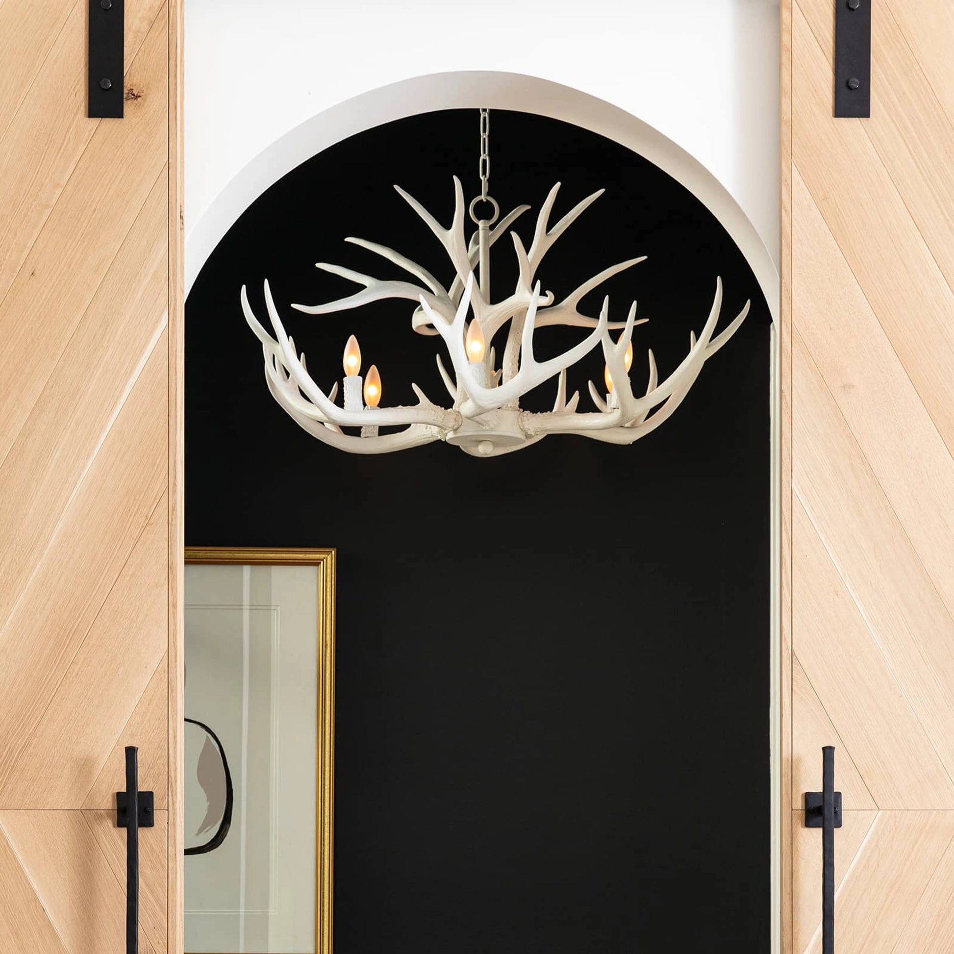 Antler Chandelier by Regina Andrew in silver leaf. Made from resin in a rustic style.