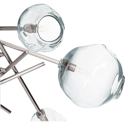 Molten Chandelier with Smoke Glass by Regina Andrew in nickel and polished nickel. Made from glass in a modern style.