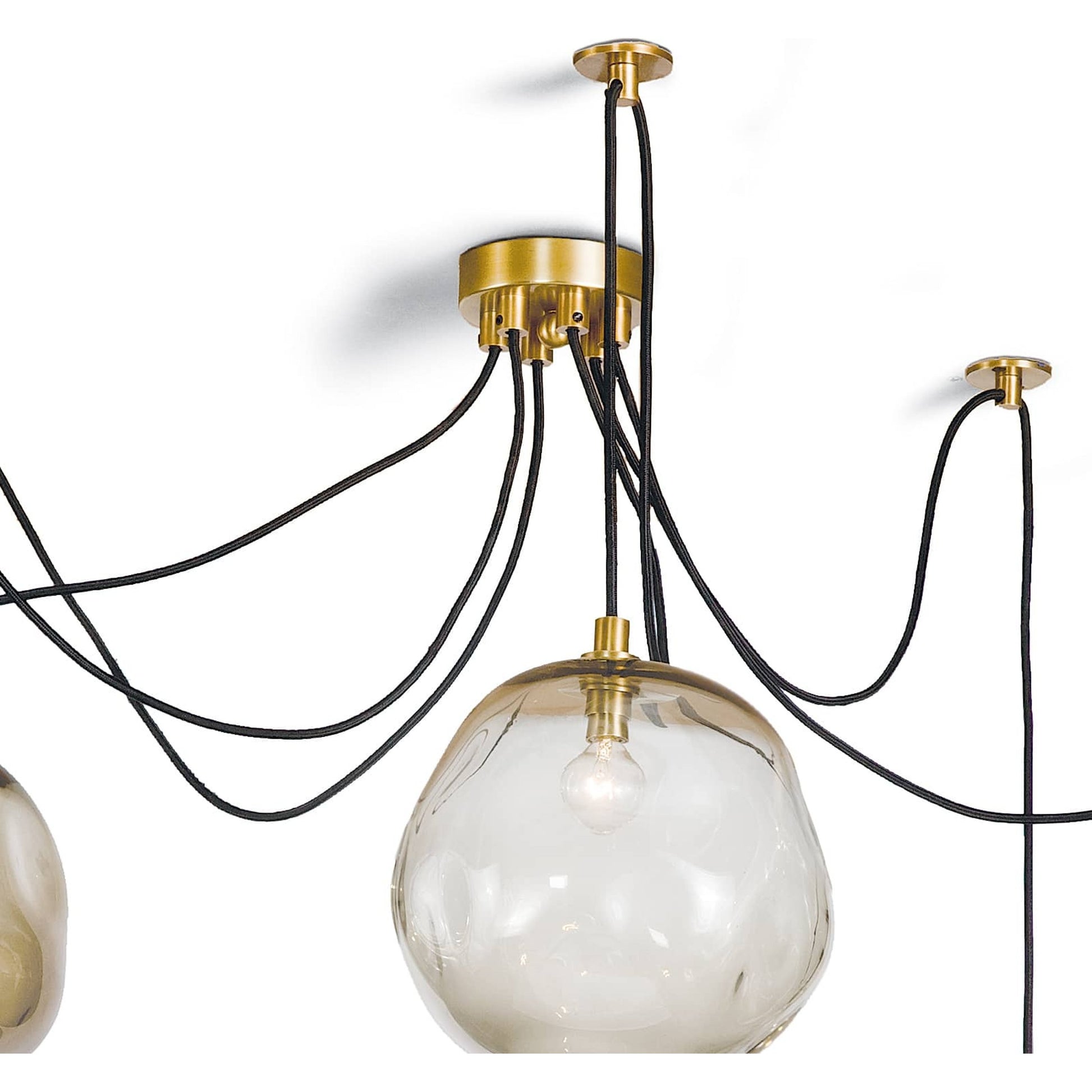 Molten Spider with Smoke Glass by Regina Andrew in brass and brass. Made from glass in a modern style.