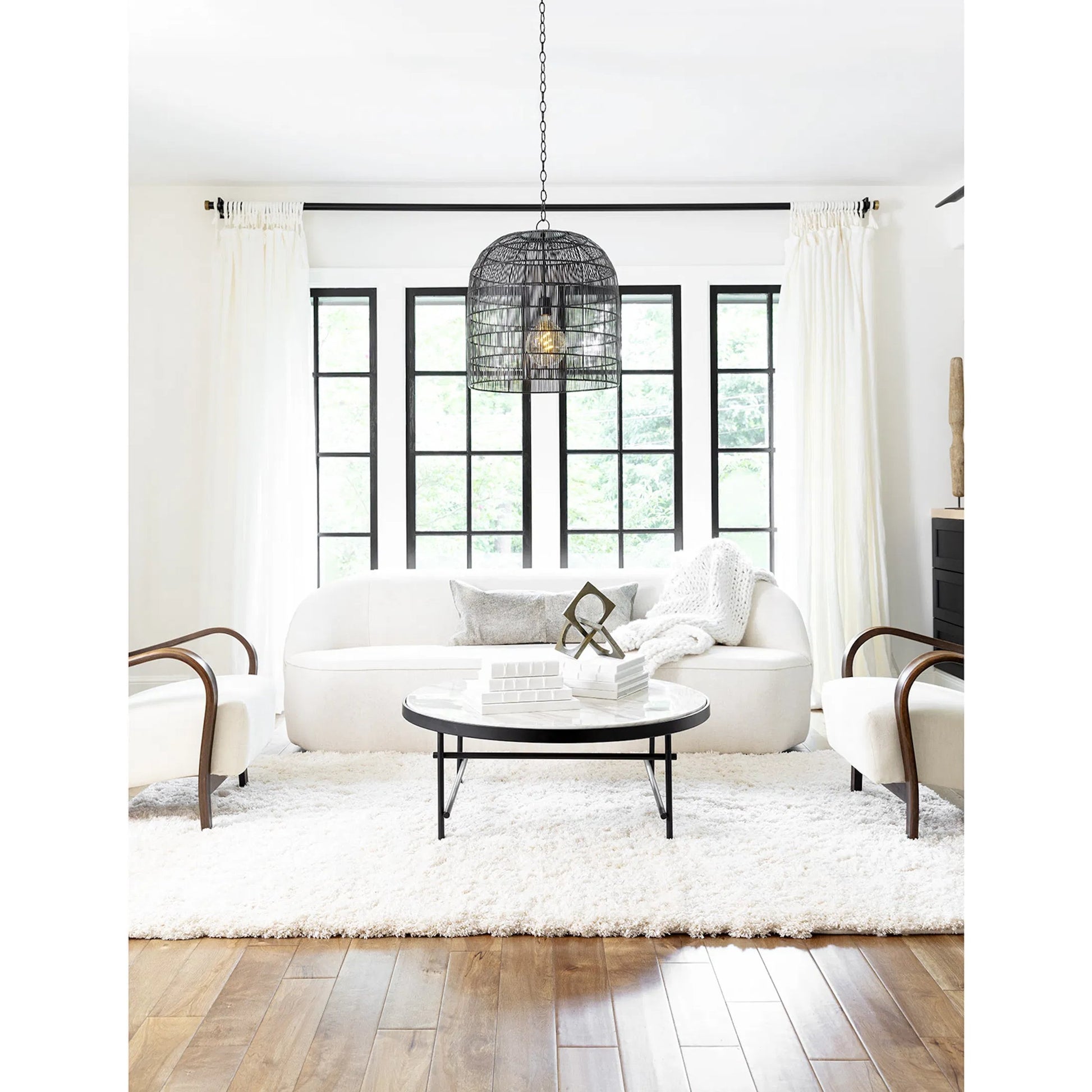 Fresco Pendant by Regina Andrew in brass. Made from iron in a coastal style.