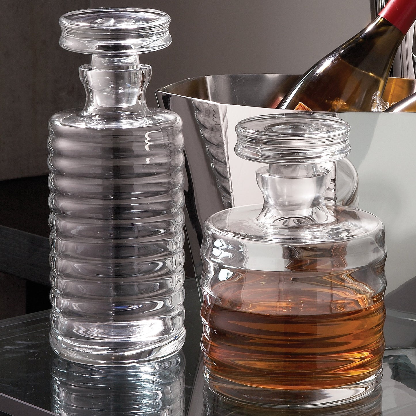 003 SR-701970,SR-701971 | Lifestyle | Ribbed Decanter by Global Views. Made from glass in a transitional style.