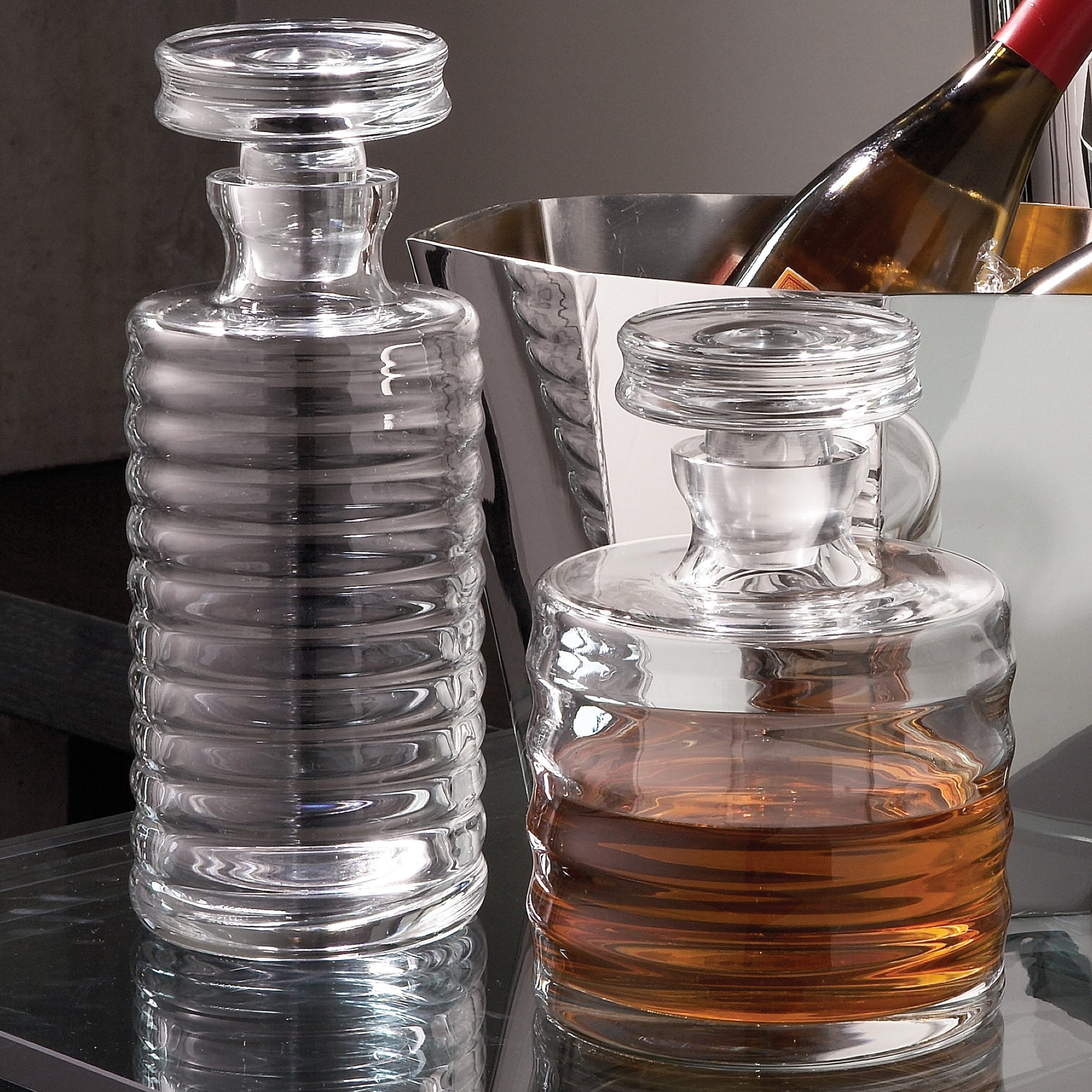 Ribbed Decanter by Global Views. Made from glass in a transitional style.