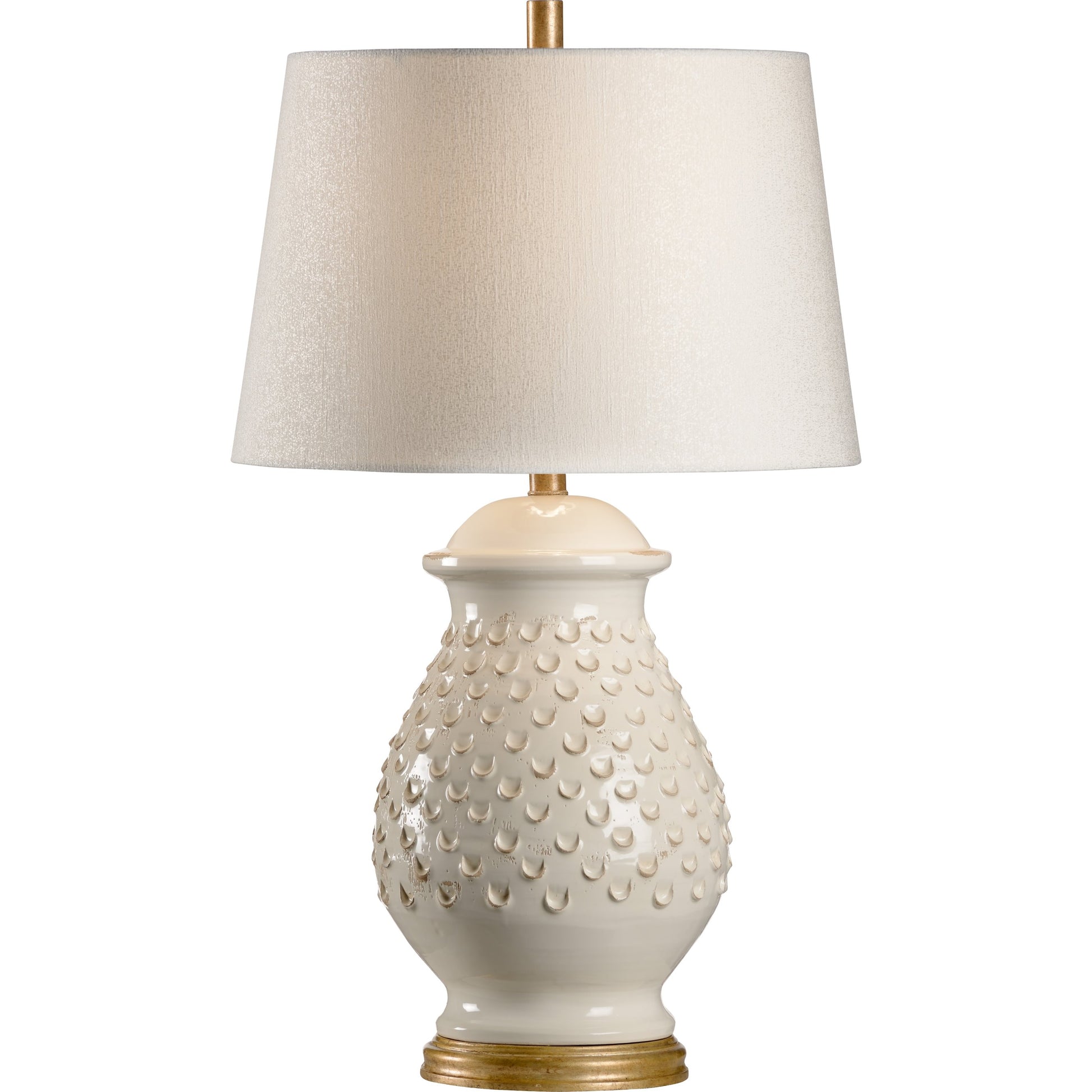 Fiera Lamp by Wildwood in hand sculpted, aged cream glaze, aged gold leaf. Made from ceramic, porcelain in a transitional style.