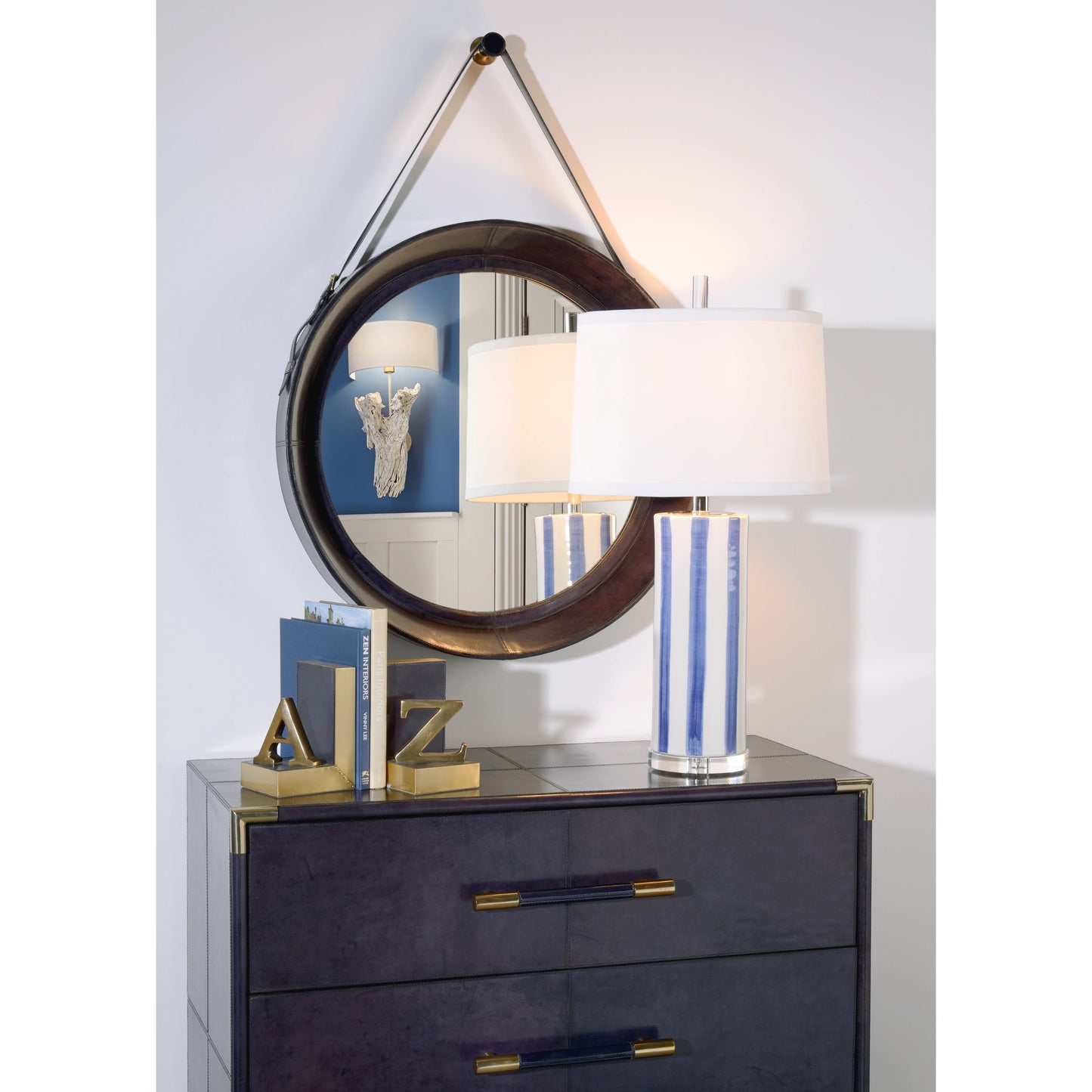 019 SR-386323 | Lifestyle | Sailor Stripe Lamp by Wildwood in aged cream, blue glaze, clear. Made from ceramic in a modern style.