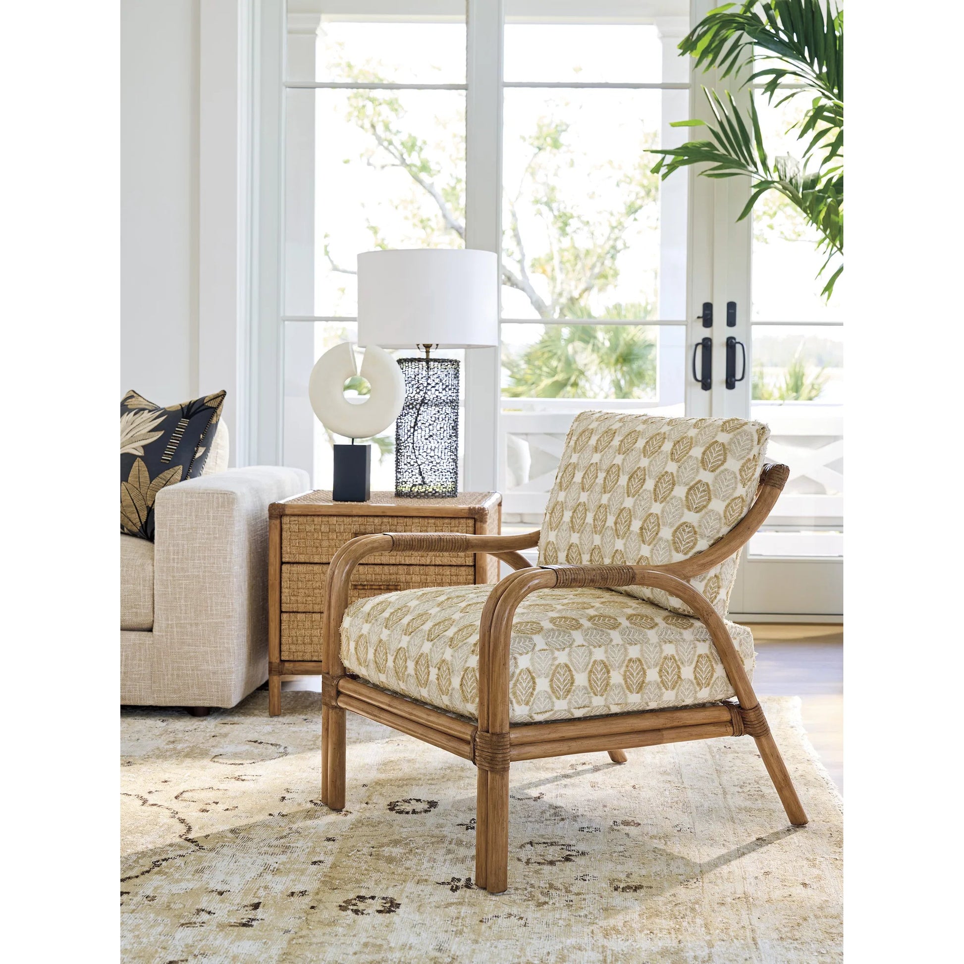 Calatrava Chair by Tommy Bahama Home. Made from leather, rattan in a unique style.