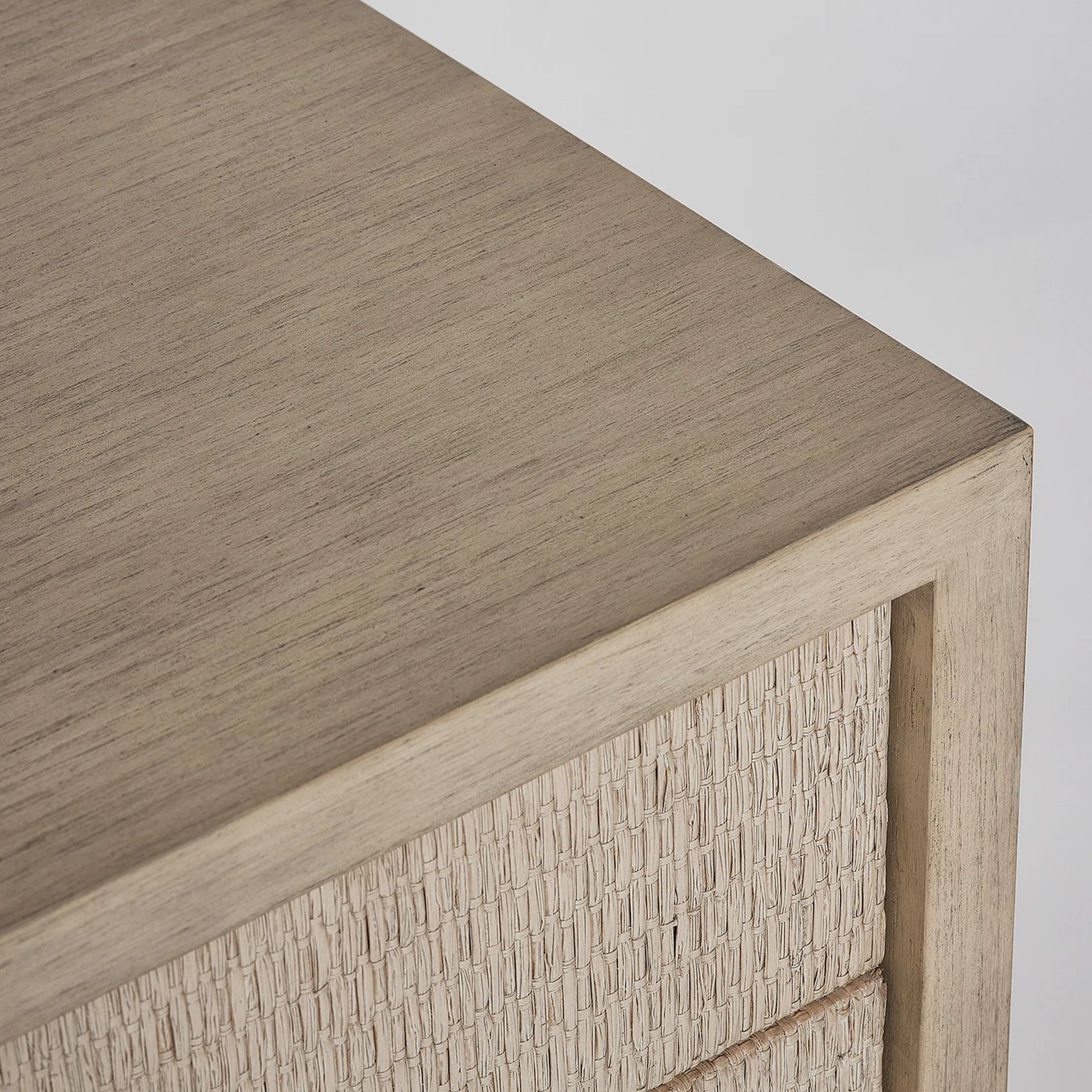 Harperly Tall Bedside Chest by Interlude Home in washed taupe, satin aged bronze. Made from sungkai wood, raffia, metal in a transitional style.