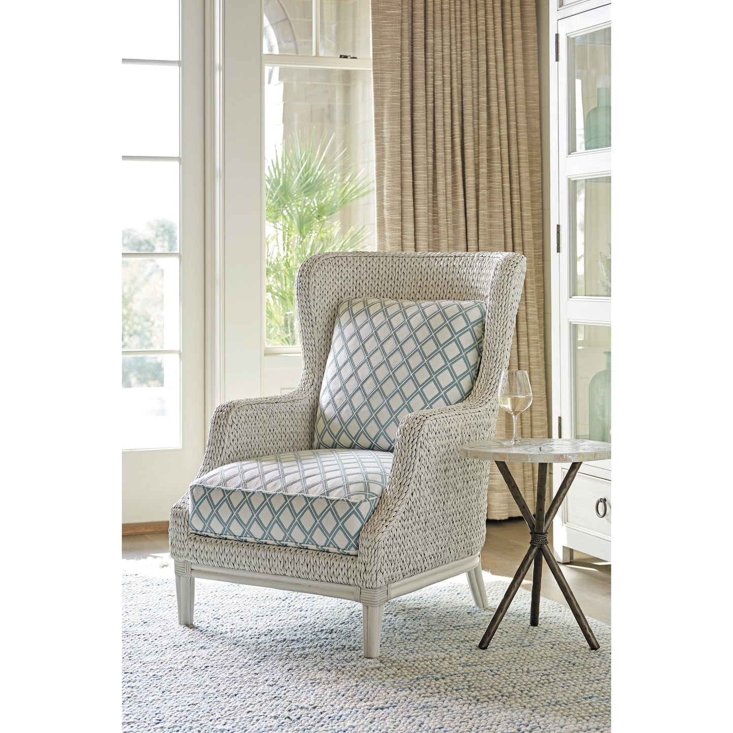 003 SR-836547 | Lifestyle | Vero Wing Chair by Tommy Bahama Home in blue mist and caribbean sands. Made from unique in a coastal style.