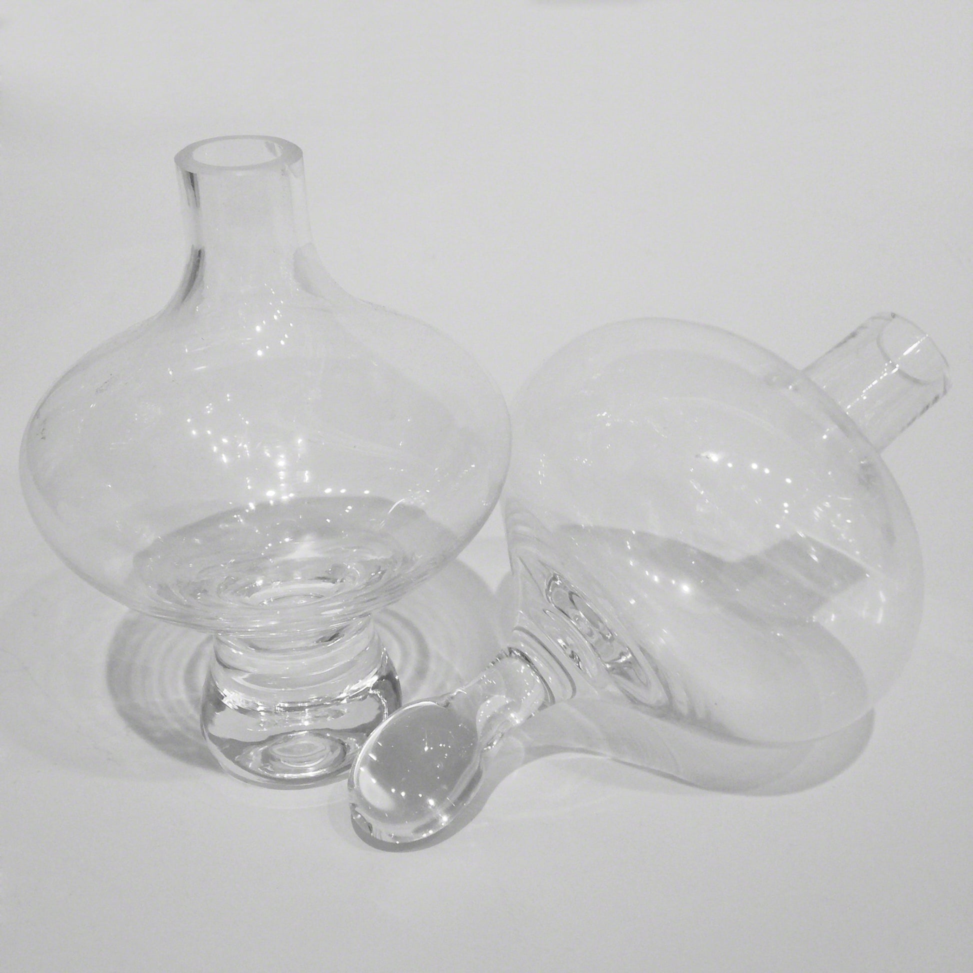 Mini Floating Footed Vase by Global Views. Made from glass in a modern style.