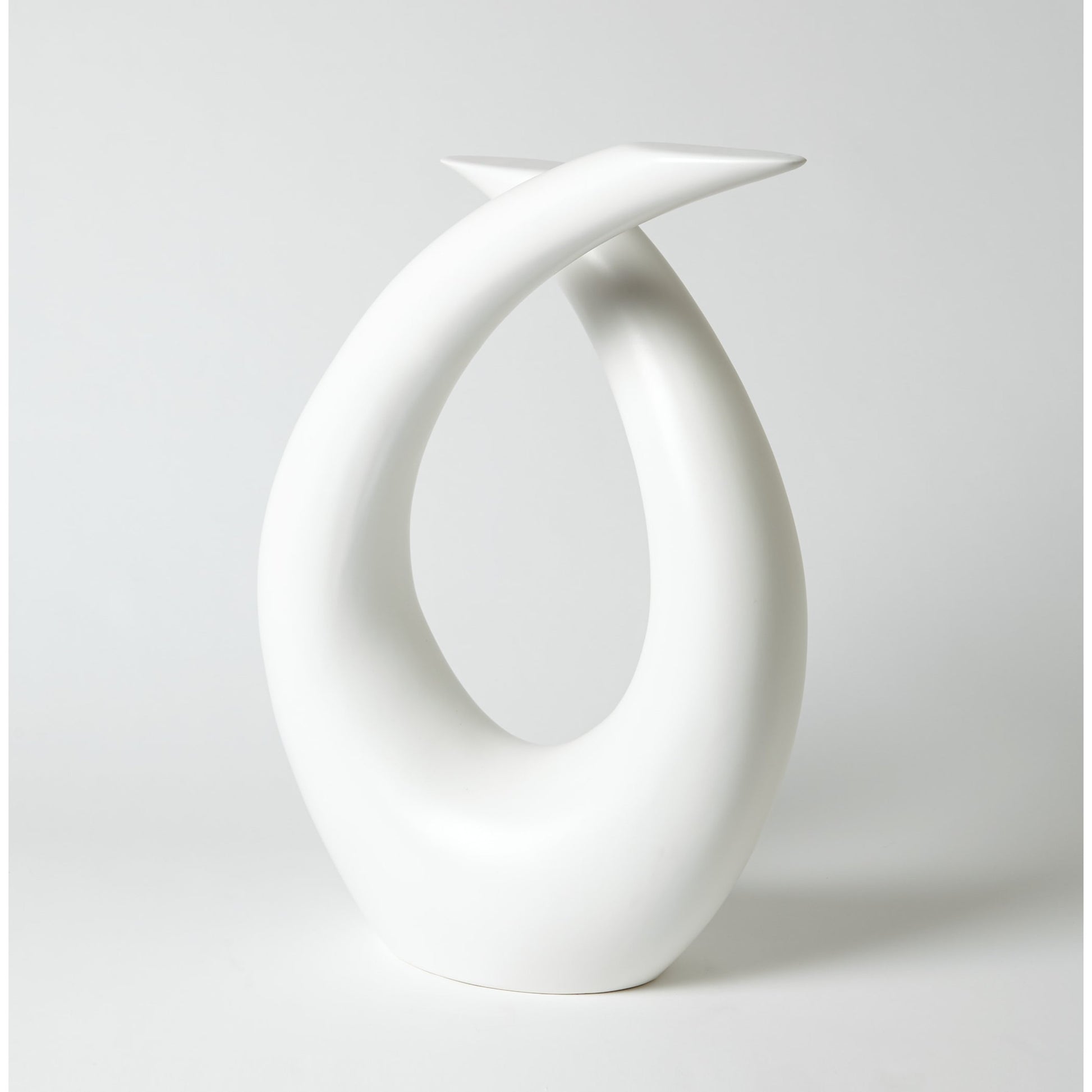Loop Sculpture by Global Views. Made from ceramic in a modern style.
