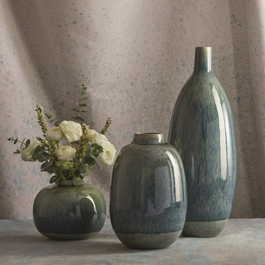 Tidal Vase by Global Views in blue. Made from earthenware in a transitional style.