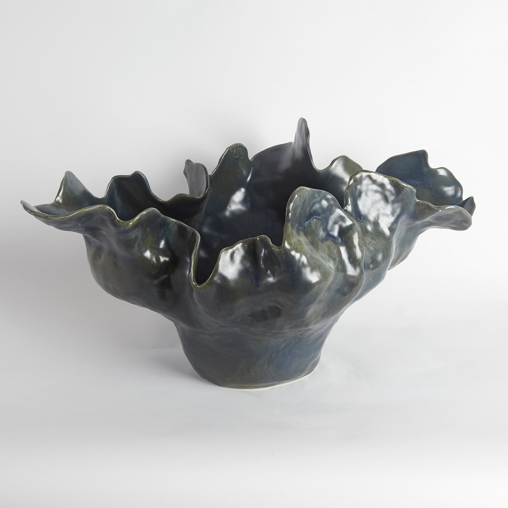 Meteor Bowl by Global Views. Made from ceramic in a coastal style.