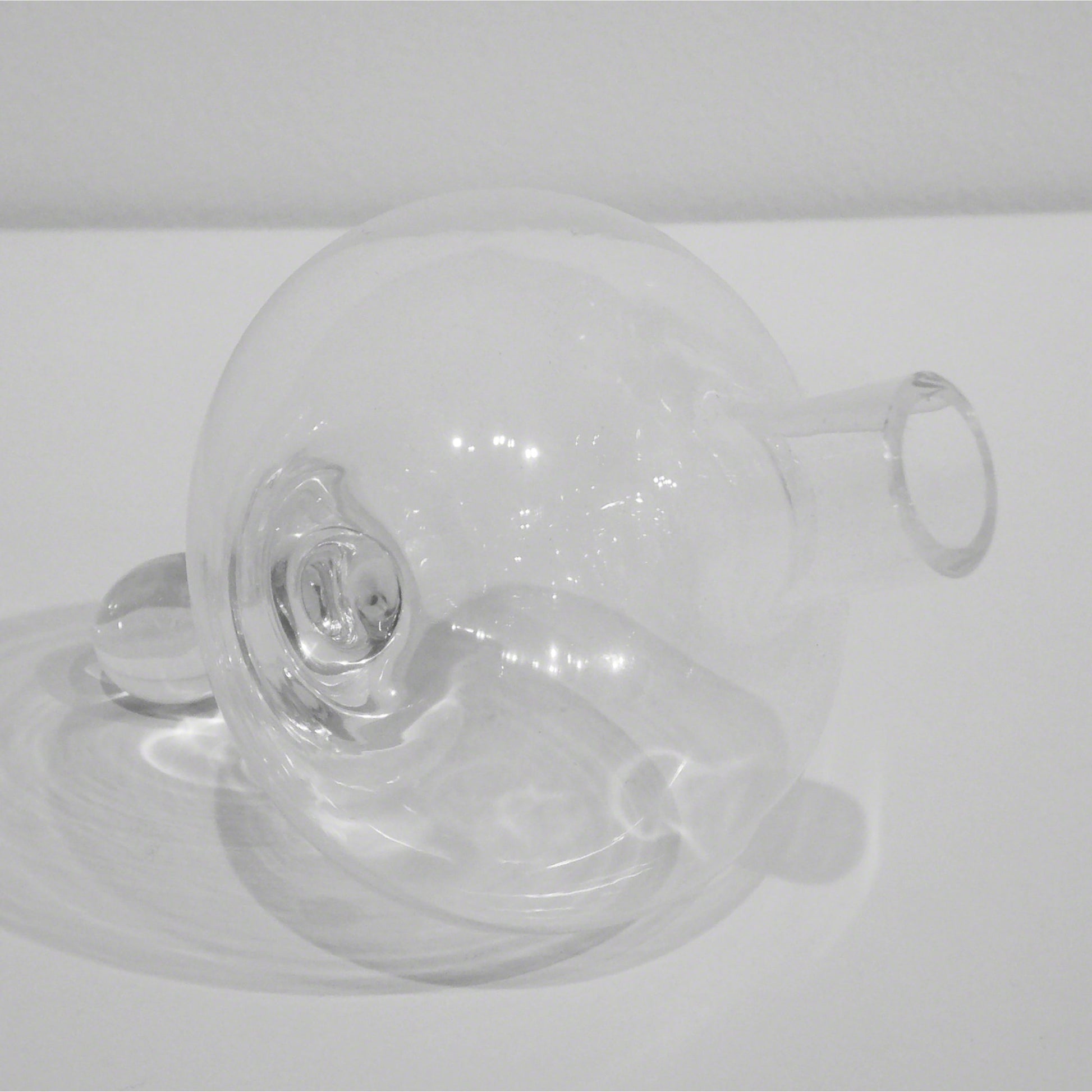 Mini Floating Droplet Vase by Global Views. Made from glass in a modern style.