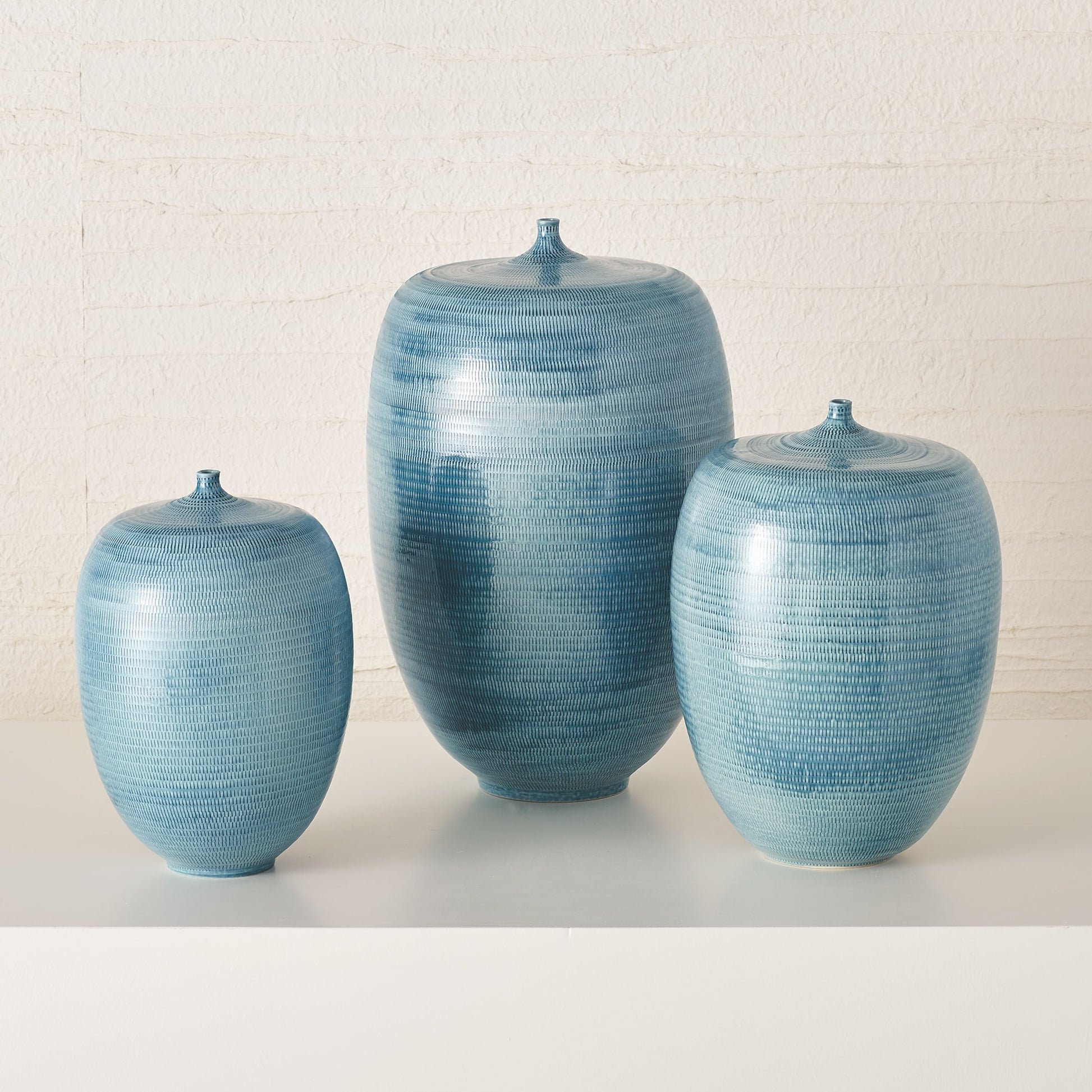 Fat Bottle by Global Views. Made from porcelain in a coastal style.
