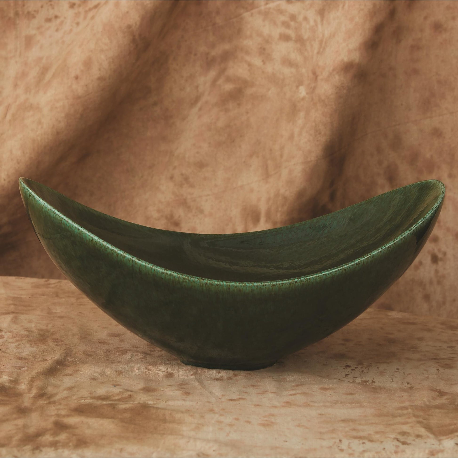Swoop Bowl by Global Views. Made from ceramic in a modern style.