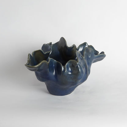 Meteor Bowl by Global Views. Made from ceramic in a coastal style.
