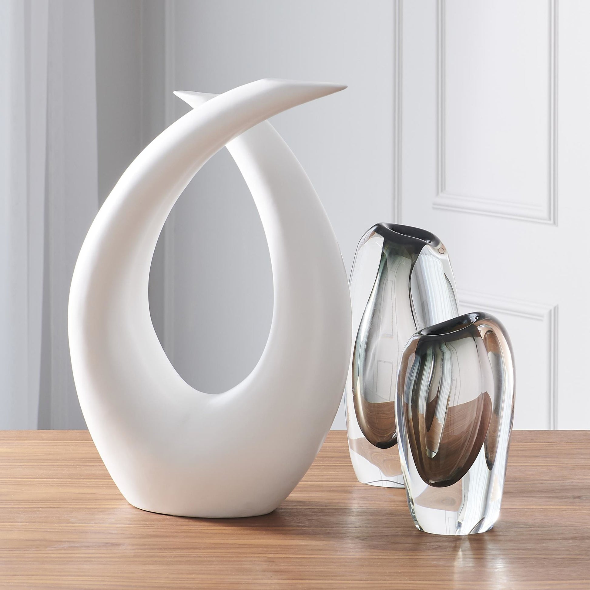Loop Sculpture by Global Views. Made from ceramic in a modern style.