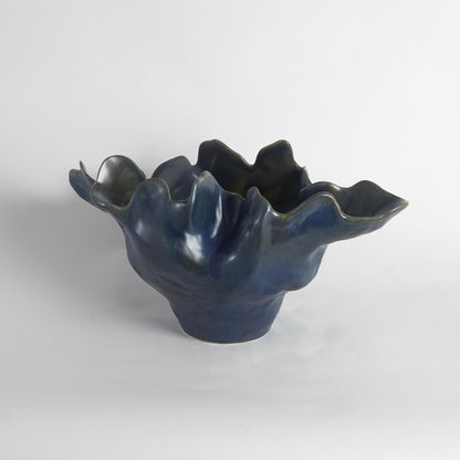 Meteor Bowl by Global Views. Made from ceramic in a coastal style.
