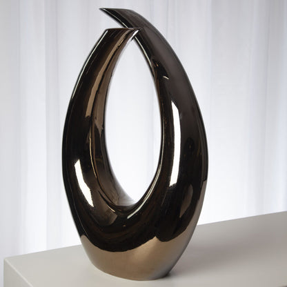 Loop Sculpture by Global Views. Made from ceramic in a modern style.