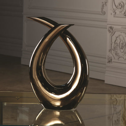 Loop Sculpture by Global Views. Made from ceramic in a modern style.