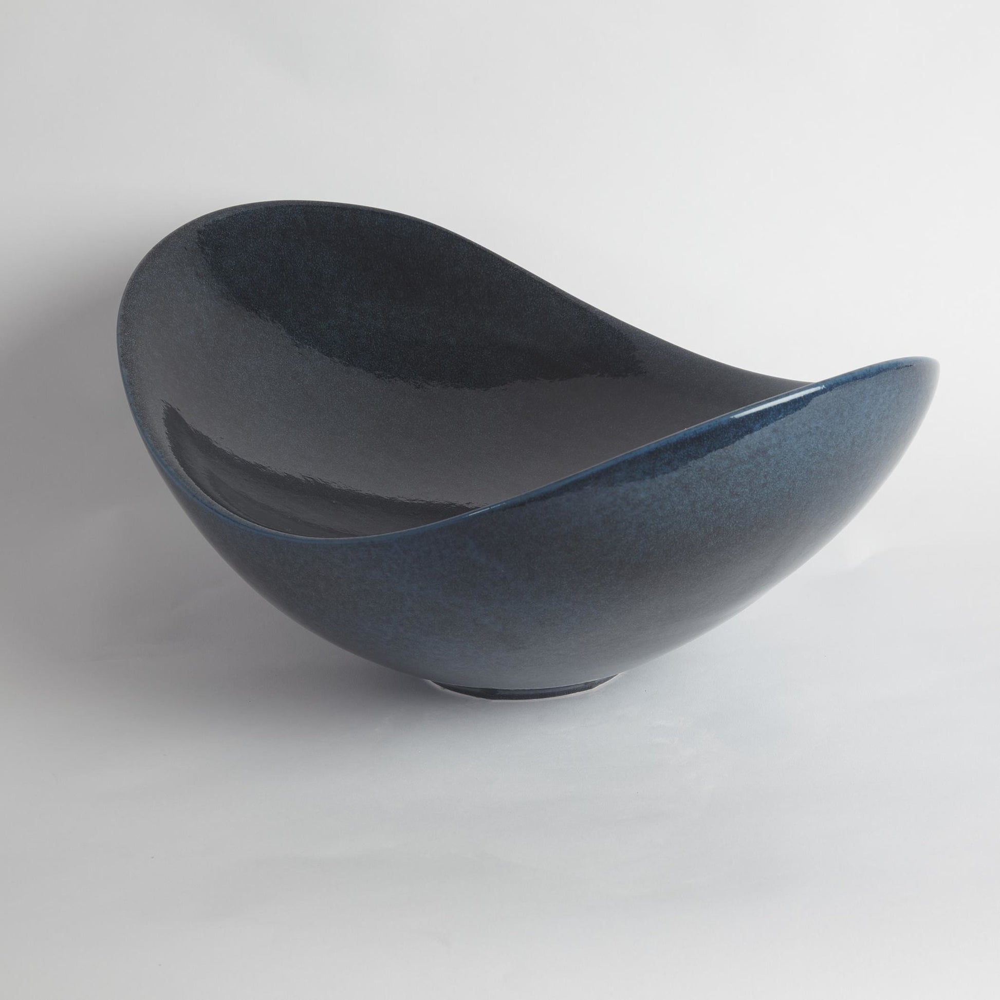 Swoop Bowl by Global Views. Made from ceramic in a modern style.