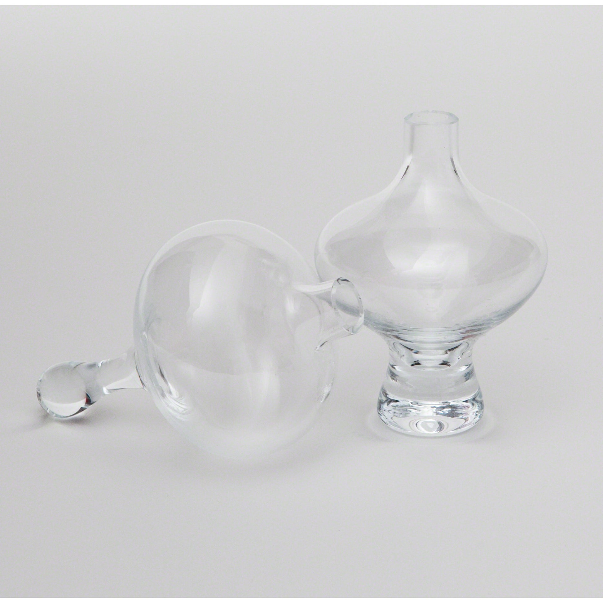 Mini Floating Footed Vase by Global Views. Made from glass in a modern style.