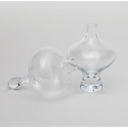 Mini Floating Footed Vase by Global Views. Made from glass in a modern style.