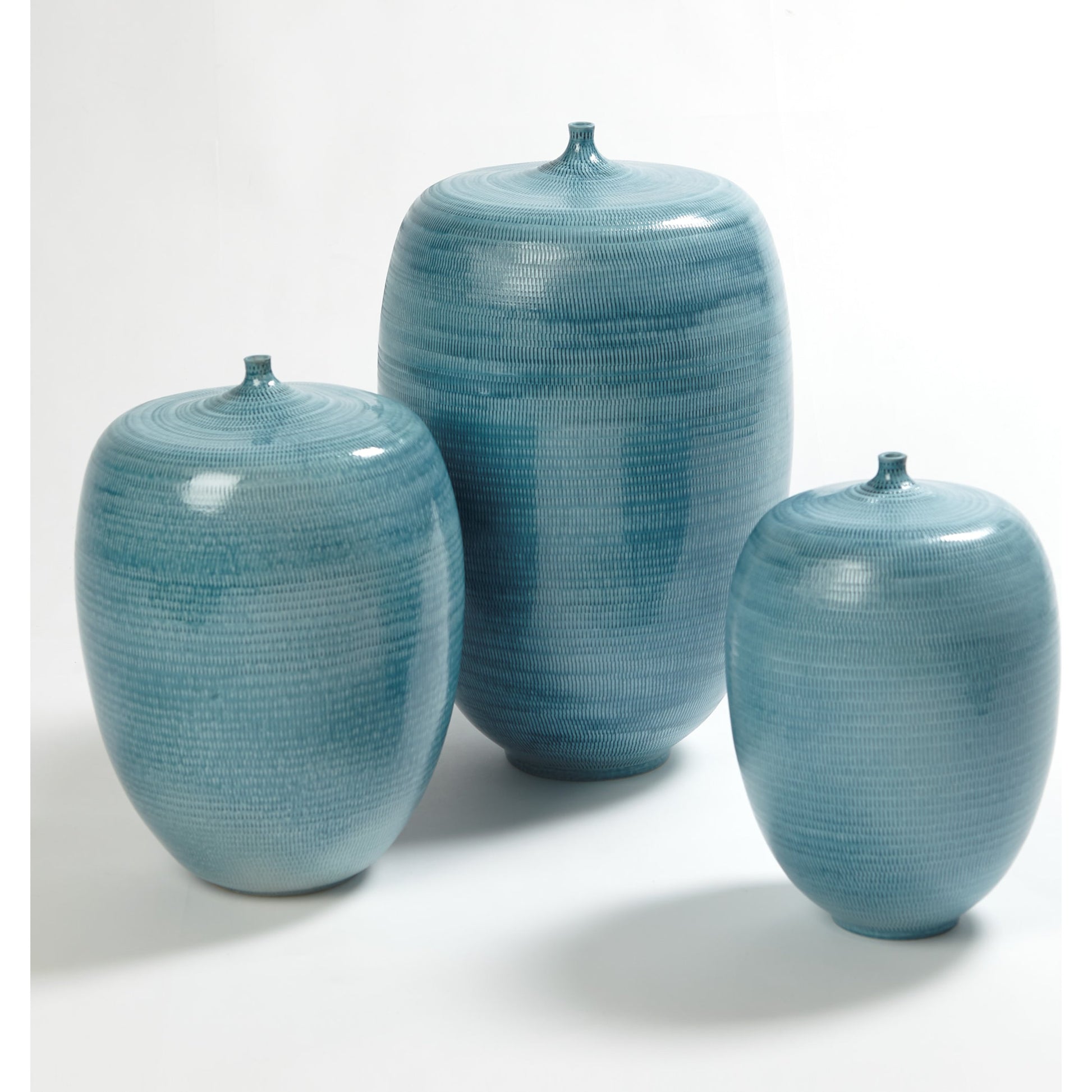 Fat Bottle by Global Views. Made from porcelain in a coastal style.
