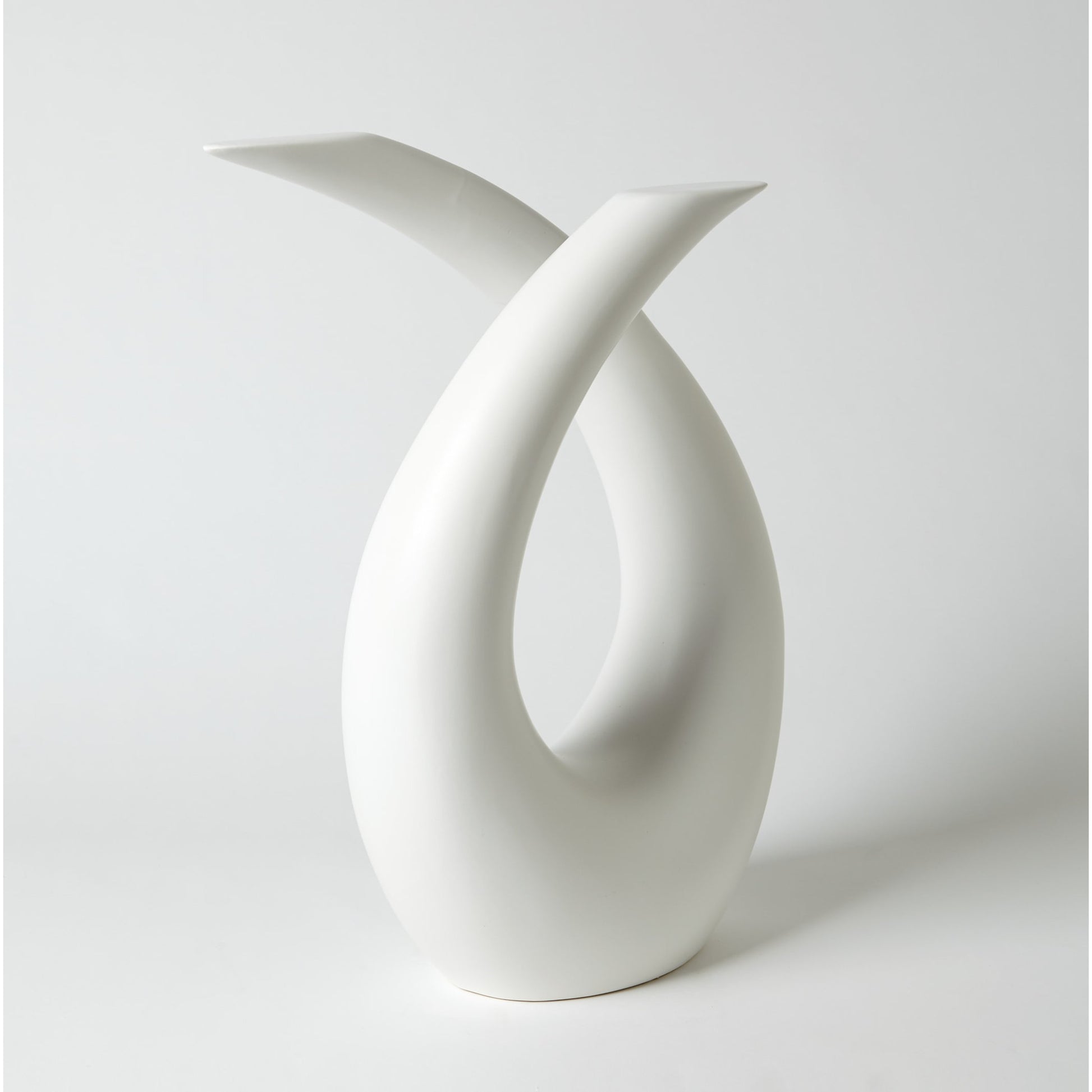 Loop Sculpture by Global Views. Made from ceramic in a modern style.