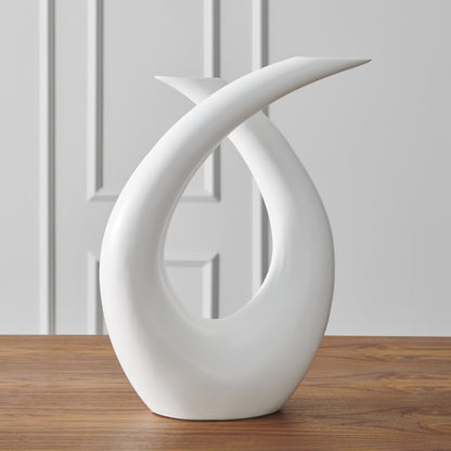 Loop Sculpture by Global Views. Made from ceramic in a modern style.