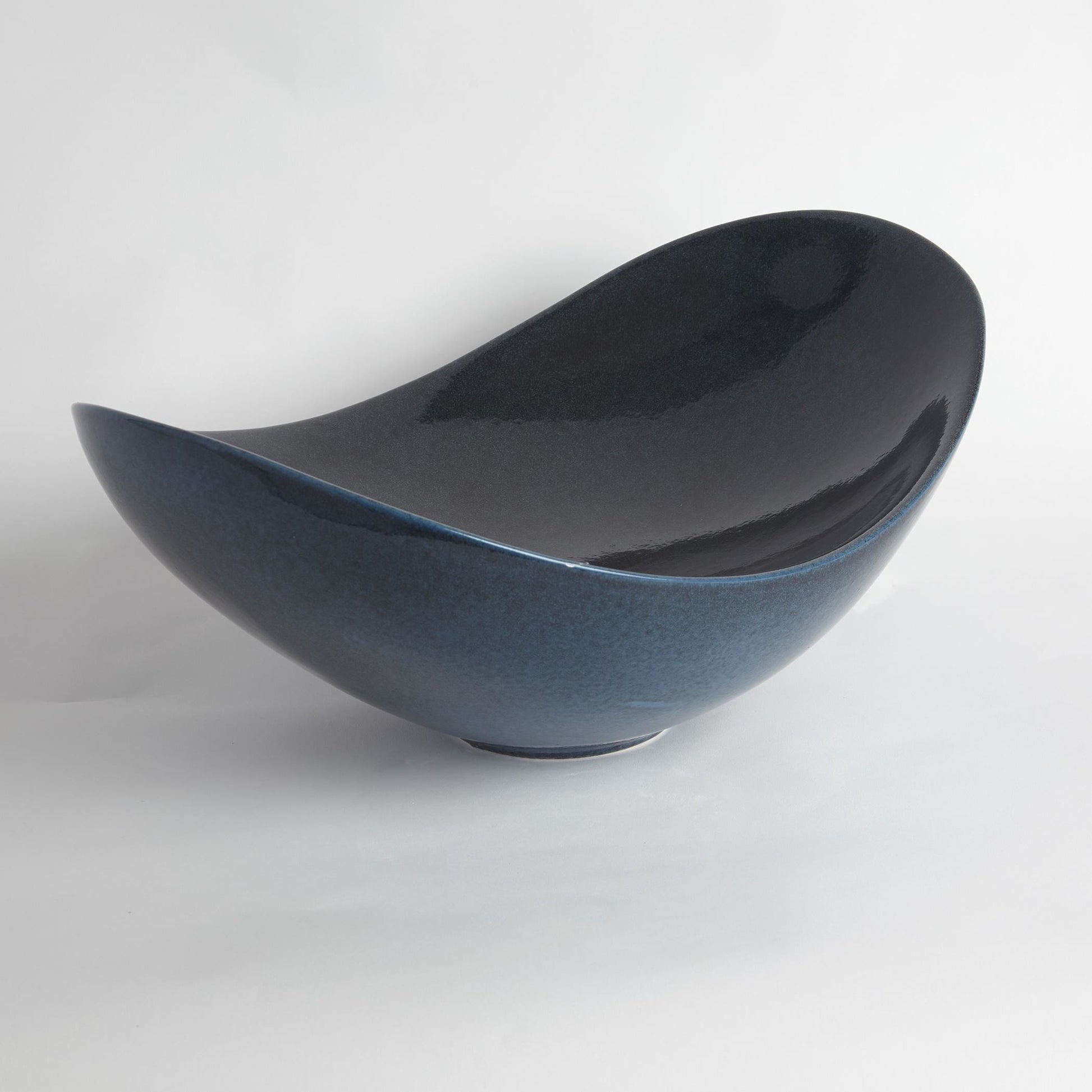 Swoop Bowl by Global Views. Made from ceramic in a modern style.