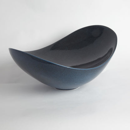 Swoop Bowl by Global Views. Made from ceramic in a modern style.