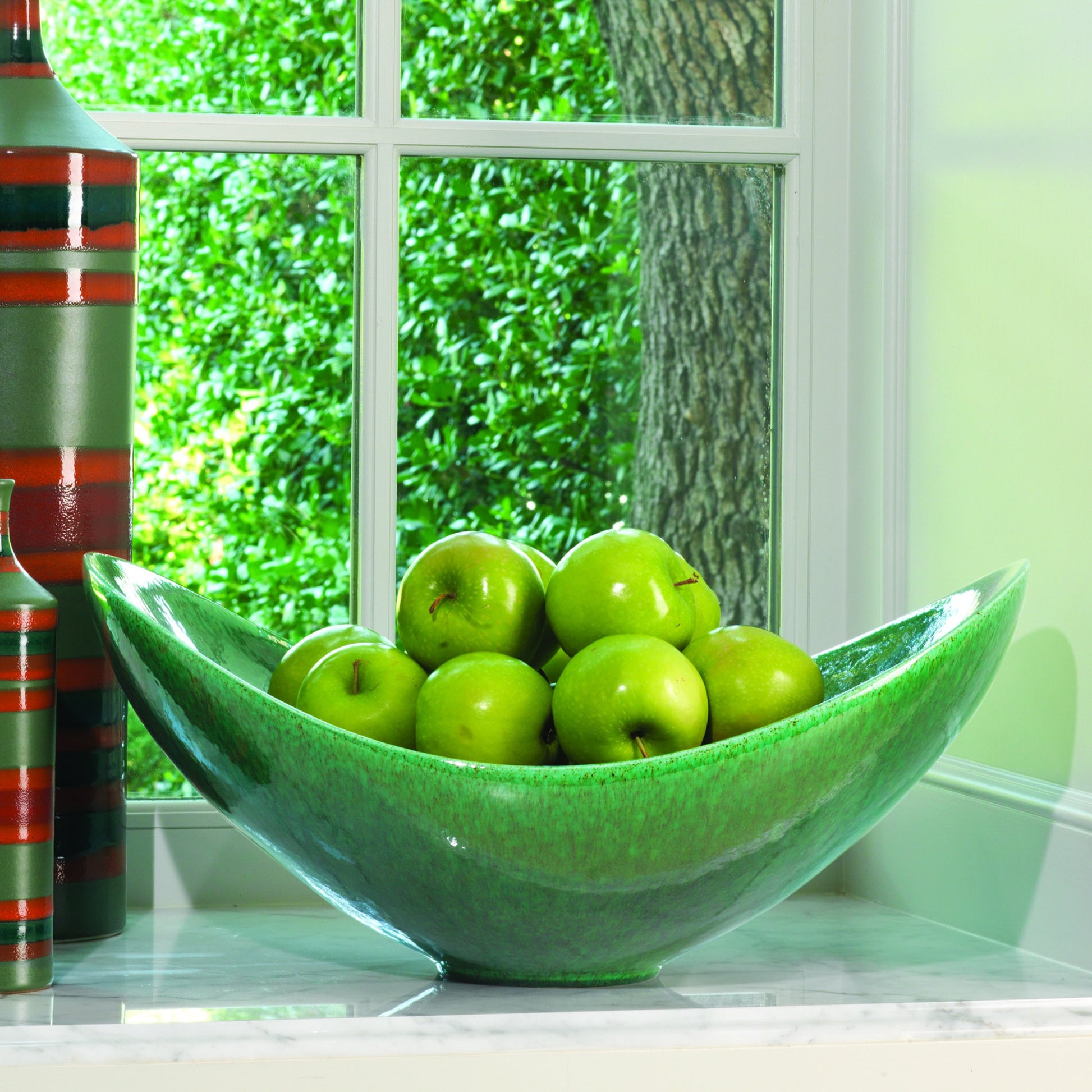 Swoop Bowl by Global Views. Made from ceramic in a modern style.
