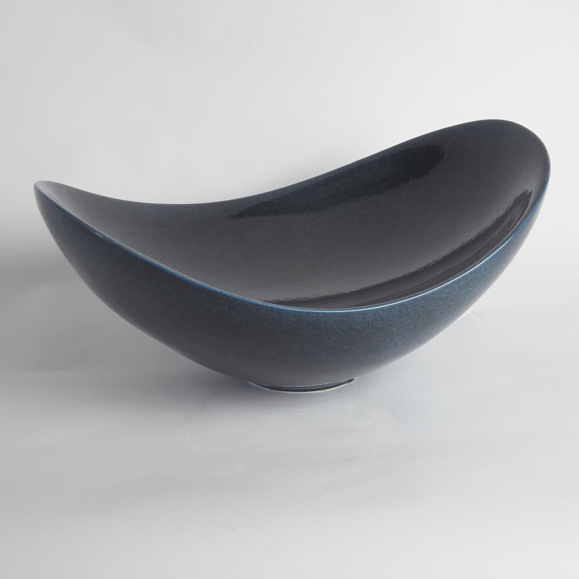 Swoop Bowl by Global Views. Made from ceramic in a modern style.