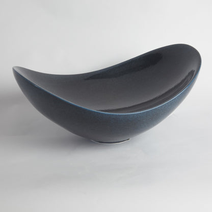 Swoop Bowl by Global Views. Made from ceramic in a modern style.