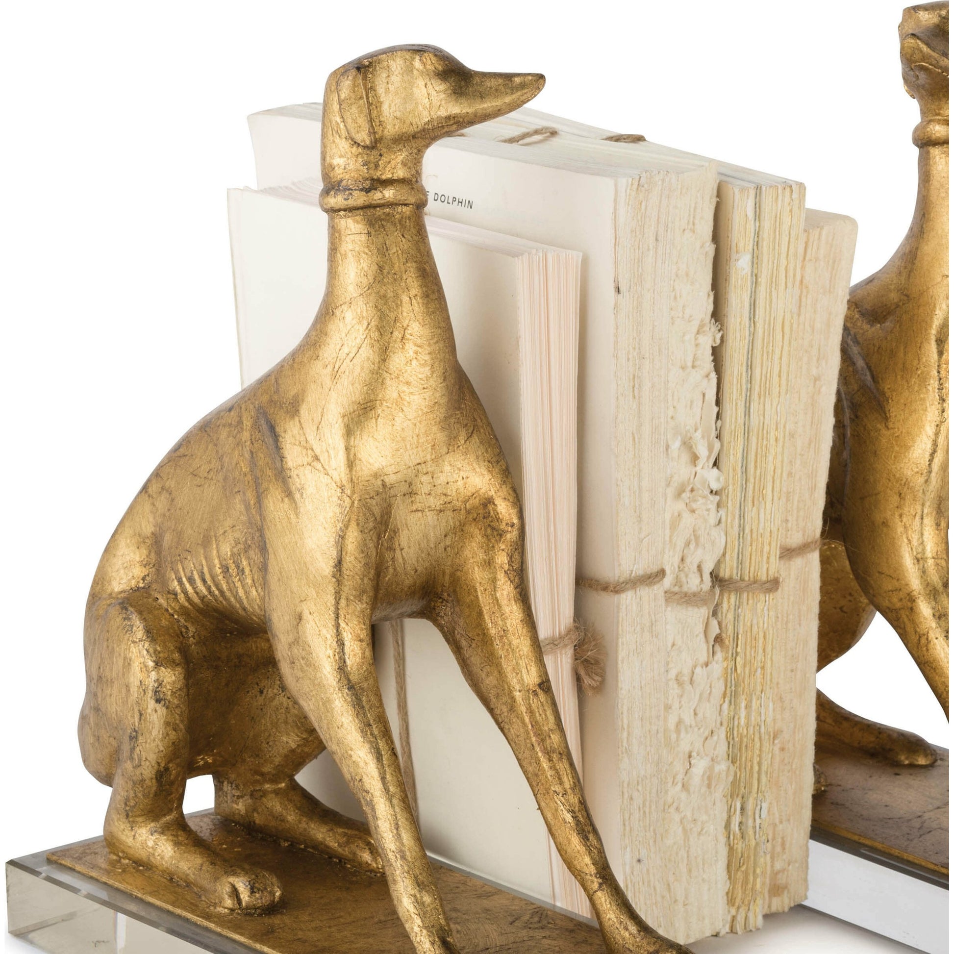 Norman Bookends by Regina Andrew in gold and antique gold leaf. Made from resin in a traditional style.